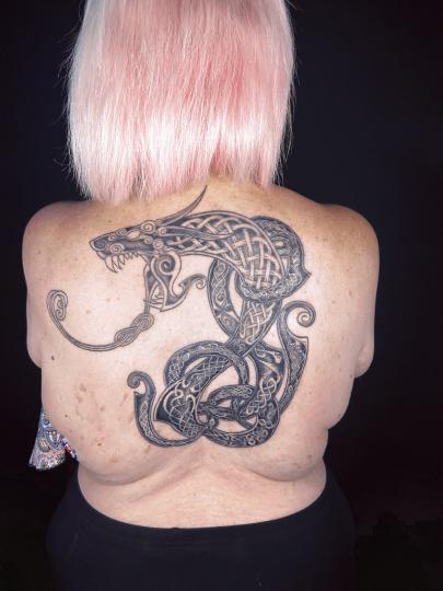 Norse style snake back tattoo