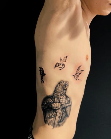 knight rib tattoo