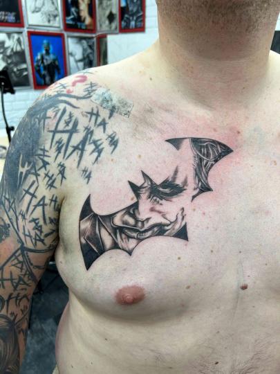 Joker black work style tattoo