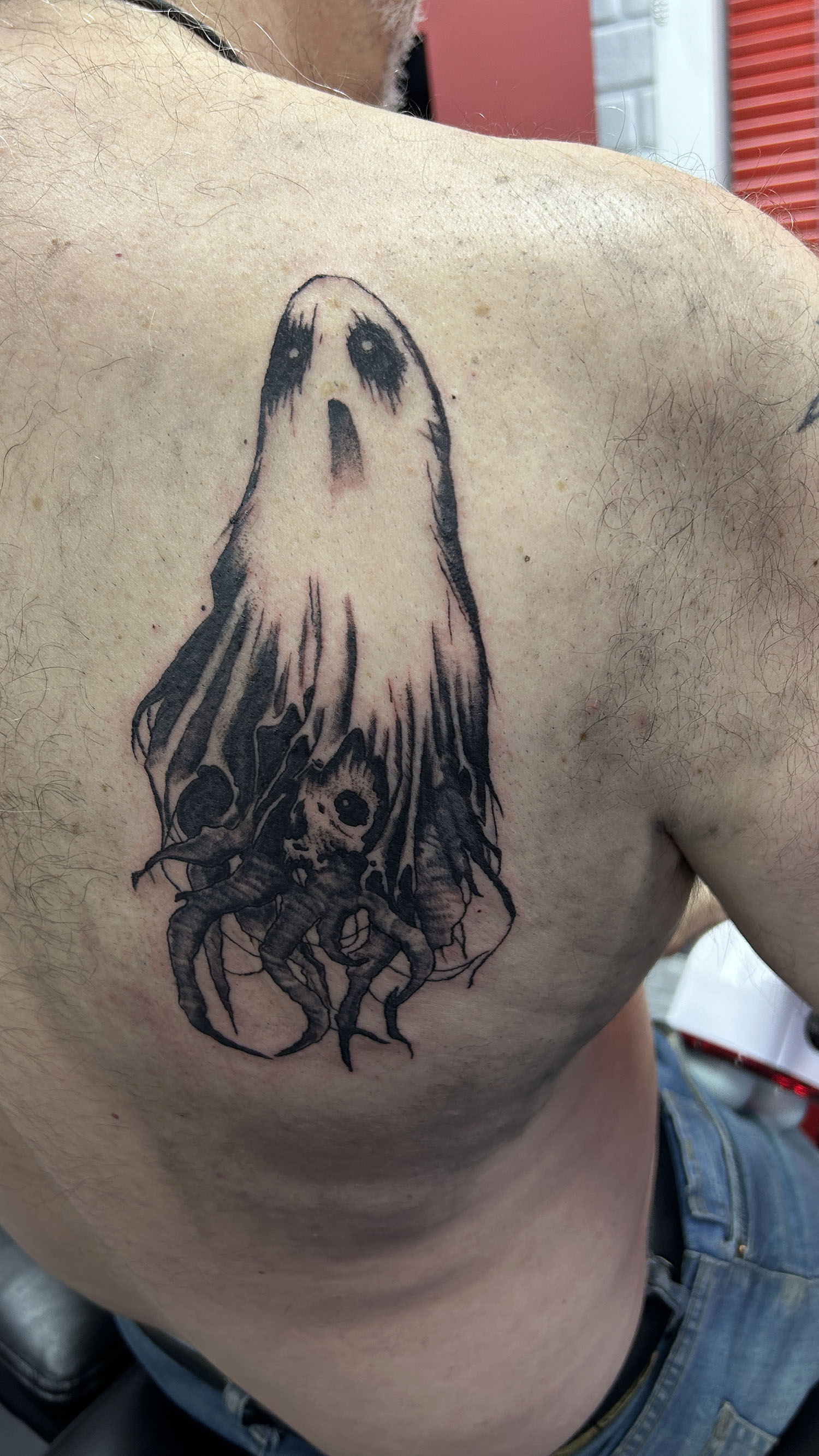 ghost on back shoulder blade