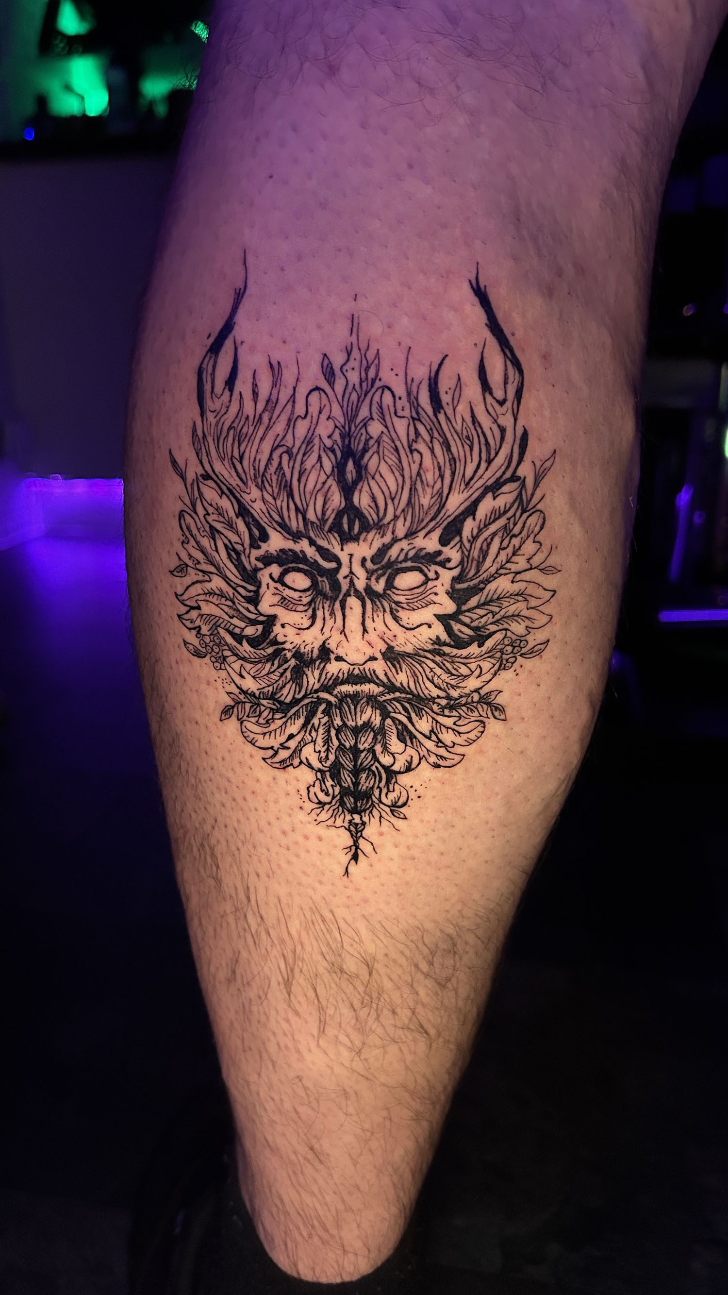 Green Man tattoo on calv