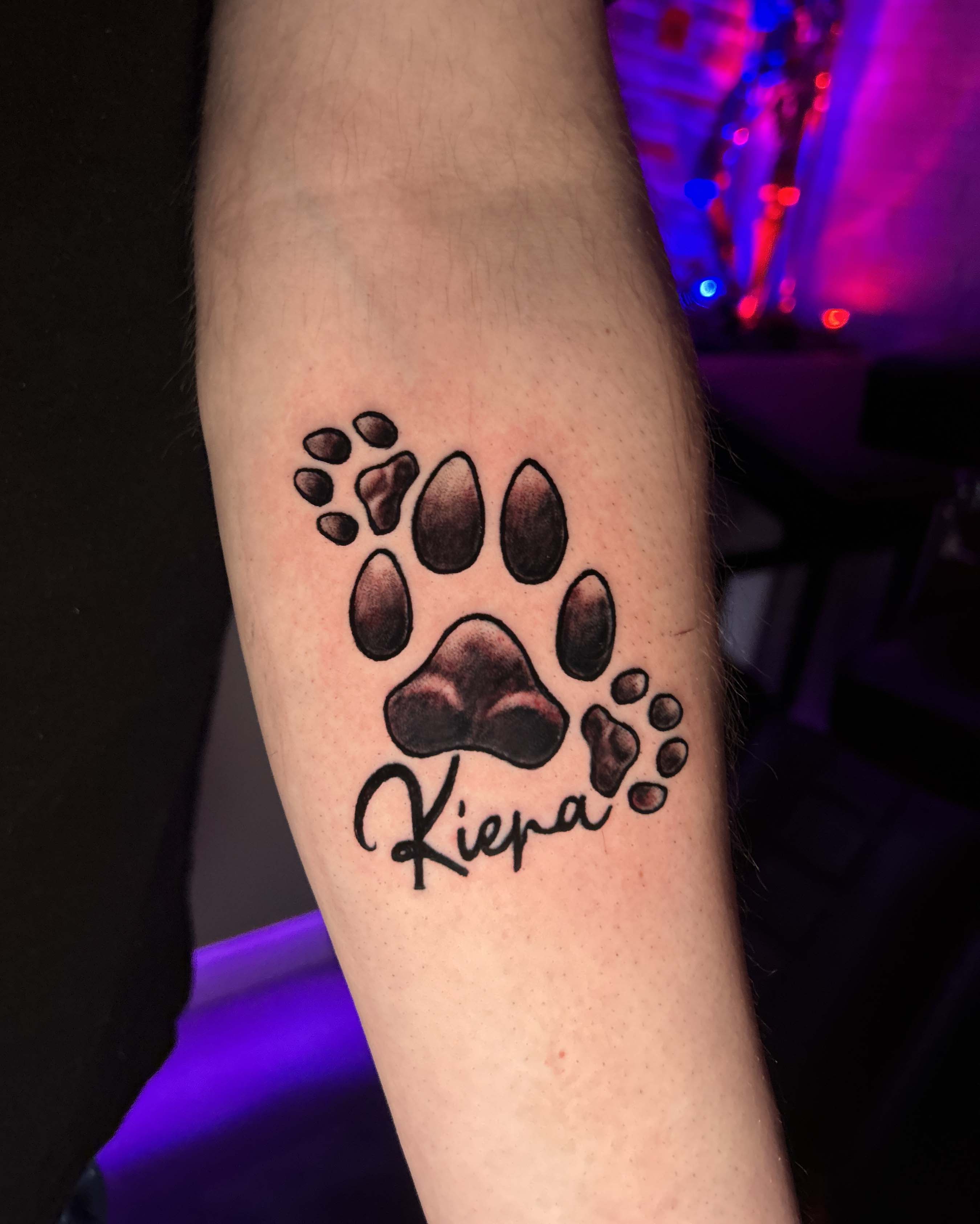 Dog paws tattoo with name
