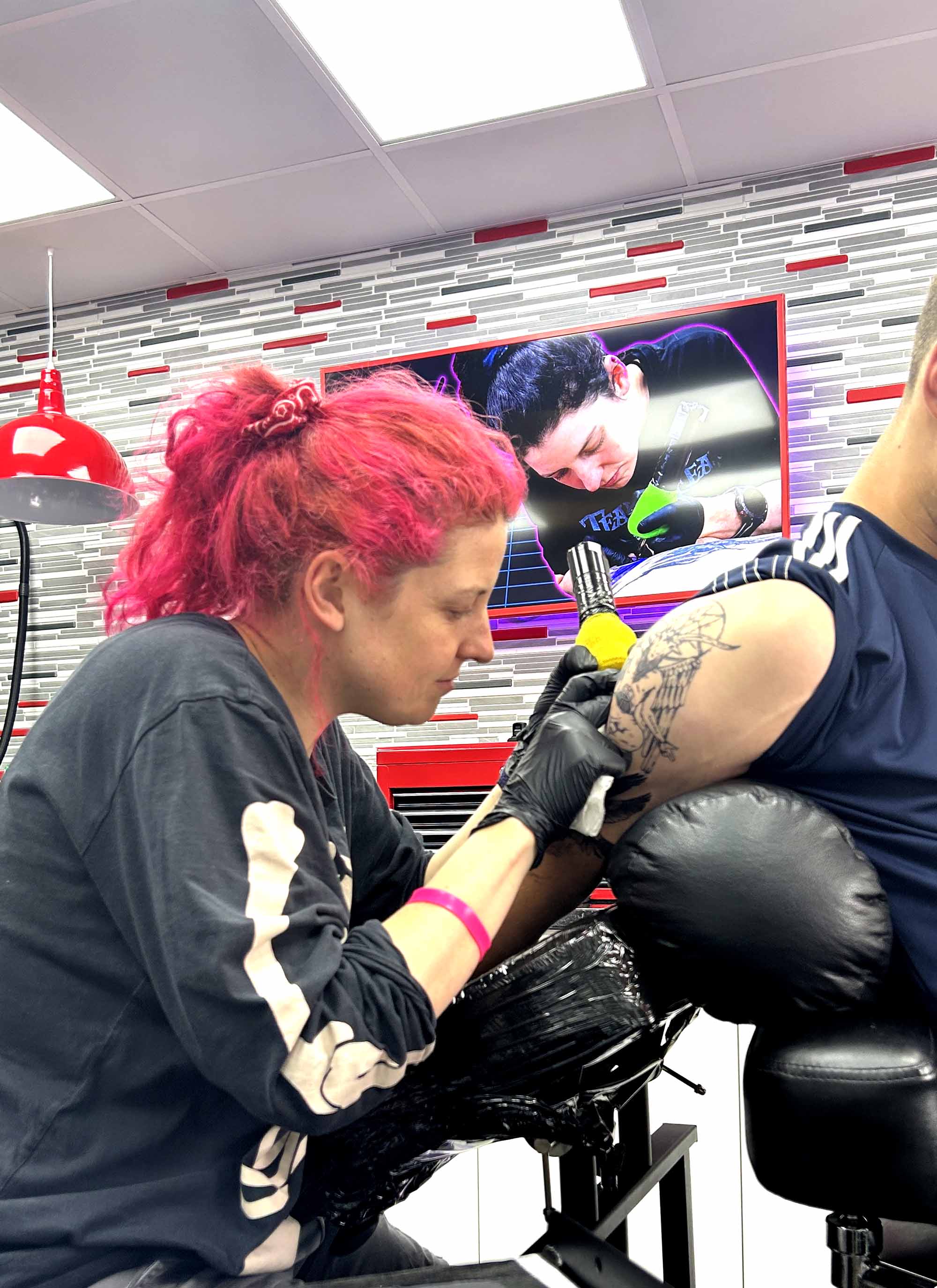 Leah tattooing